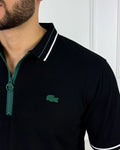 Camisa polo hombre negro con cierre verde y logo bordado, estilo moderno y premium